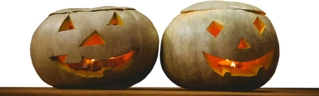 Two Transparent Jack-o'-Lanterns with Candles Glowing Inside on Table - Download Free Stock Images Pikwizard.com