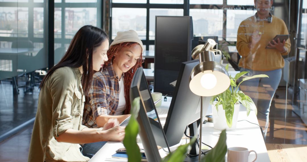 Diverse Coworkers Engaged in Collaborative Office Work