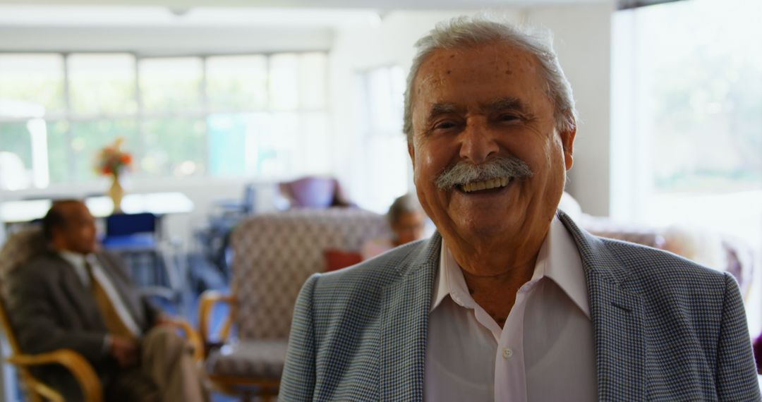 Smiling Senior Man in Nursing Home Relaxed Environment