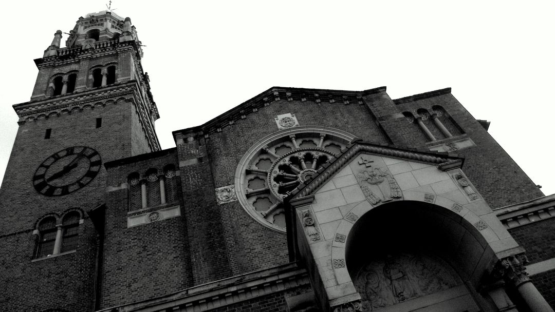 Historic Church Building with Clock Tower in Black and White - Free Images, Stock Photos and Pictures on Pikwizard.com