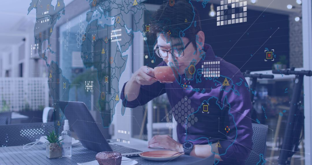 Business Professional Using Laptop While Enjoying Coffee