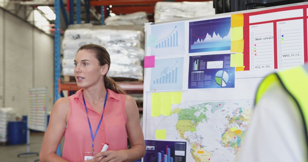 Warehouse Manager Presenting Strategy in Industrial Setting