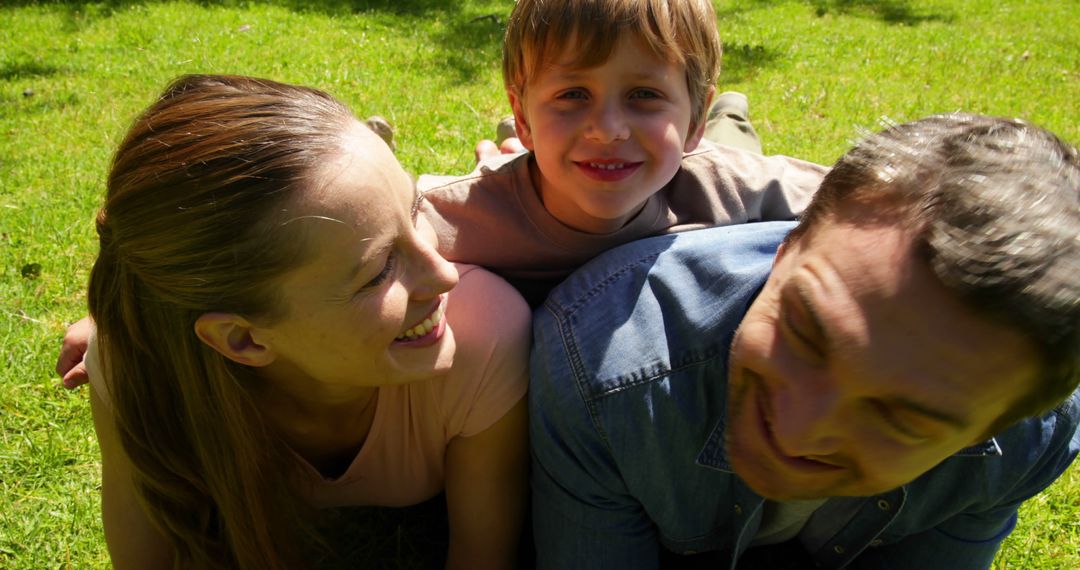 Happy Family Laughing Together Outdoors in Milestone Moment - Free Images, Stock Photos and Pictures on Pikwizard.com