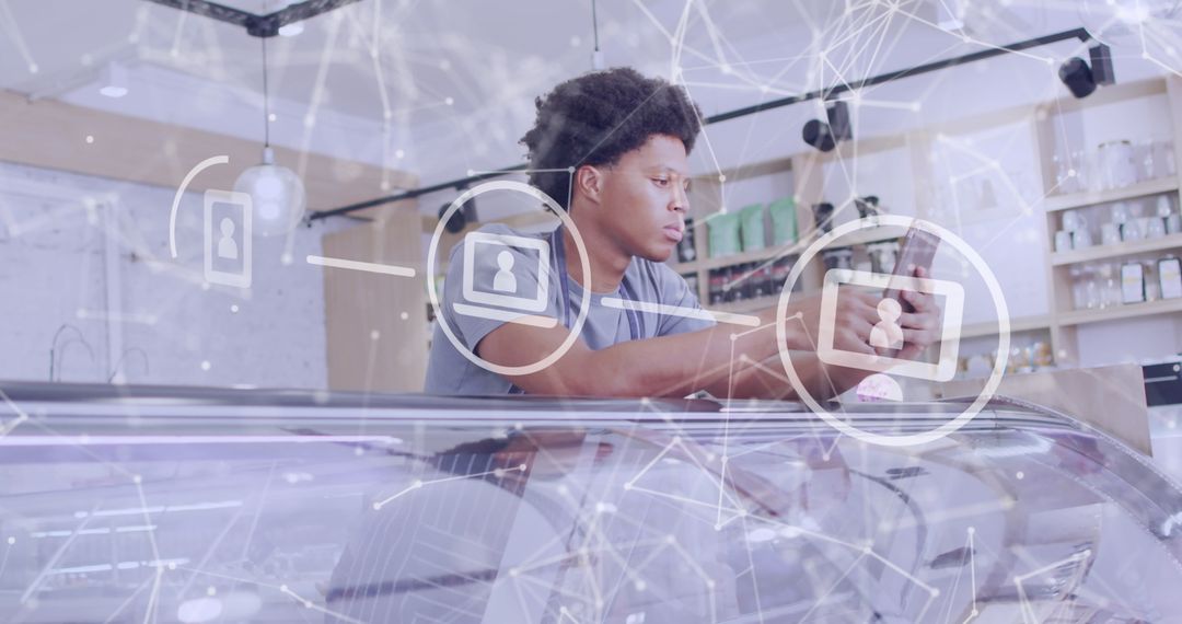 Shop Assistant Engaged with Digital Interface on Smartphone