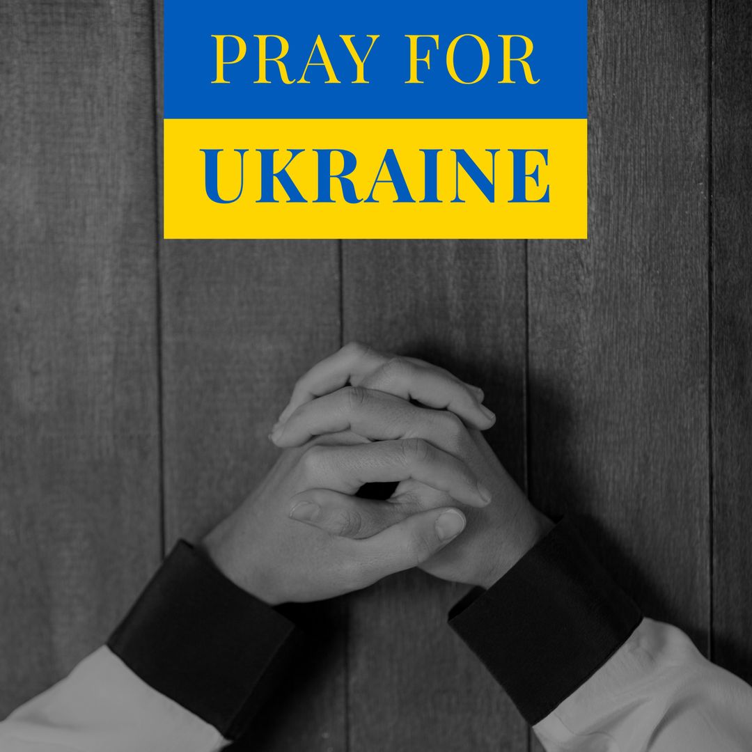 Hands Together Praying with 'Pray for Ukraine' Text Overlay