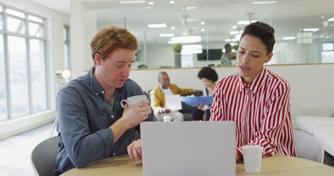 Collaborative Team Meeting in Modern Office Workspace