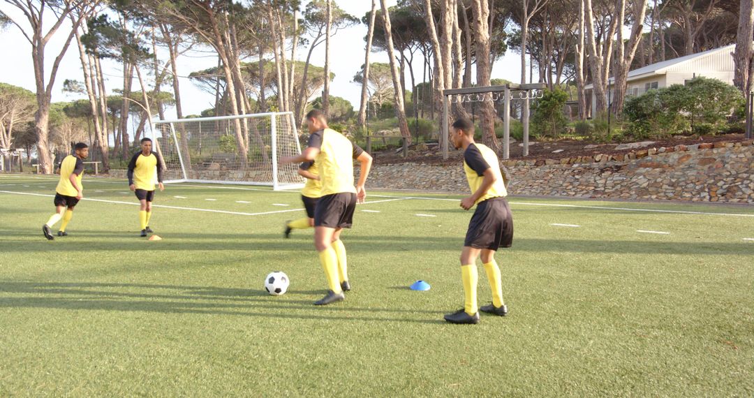 Soccer Players Practicing Teamwork on Field with Intensity
