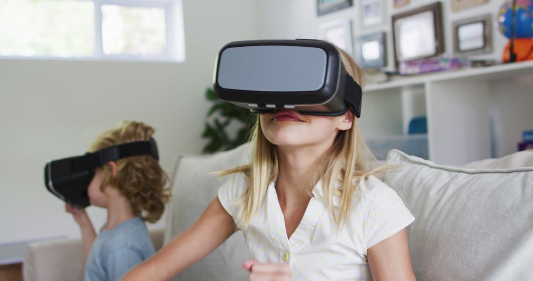 Children Enjoying Virtual Reality in Living Room - Free Images, Stock Photos and Pictures on Pikwizard.com