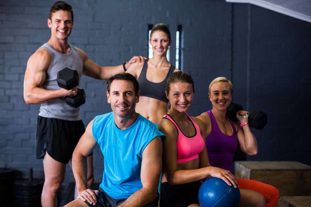 Group of Happy Athletes in Fitness Studio - Free Images, Stock Photos and Pictures on Pikwizard.com