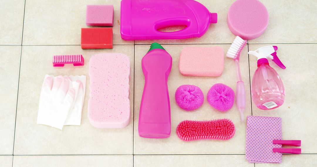 Assorted Pink Cleaning Supplies Arranged on Tile Floor - Free Images, Stock Photos and Pictures on Pikwizard.com