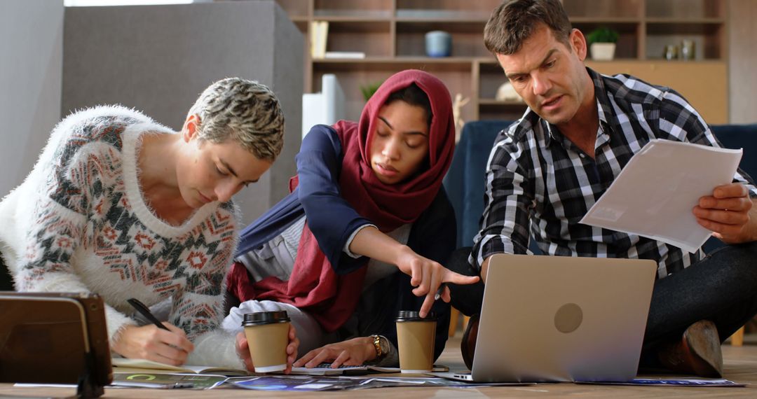 Diverse Team Collaborating on Creative Project in Office Space