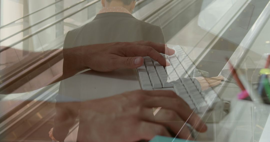 Businessman at Airport with Hands on Keyboard Overlay