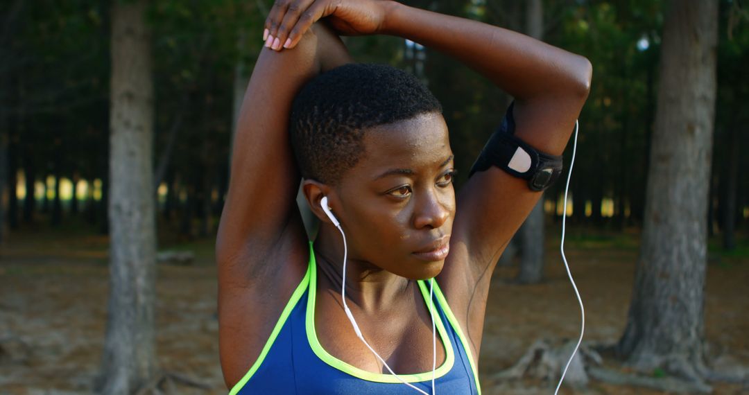 Athletic Woman Stretching in Forest - Free Images, Stock Photos and Pictures on Pikwizard.com