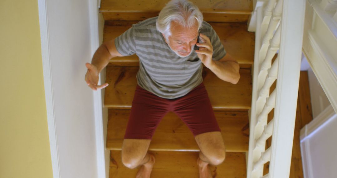 Elderly Man Sitting on Stairs and Talking on Phone - Free Images, Stock Photos and Pictures on Pikwizard.com