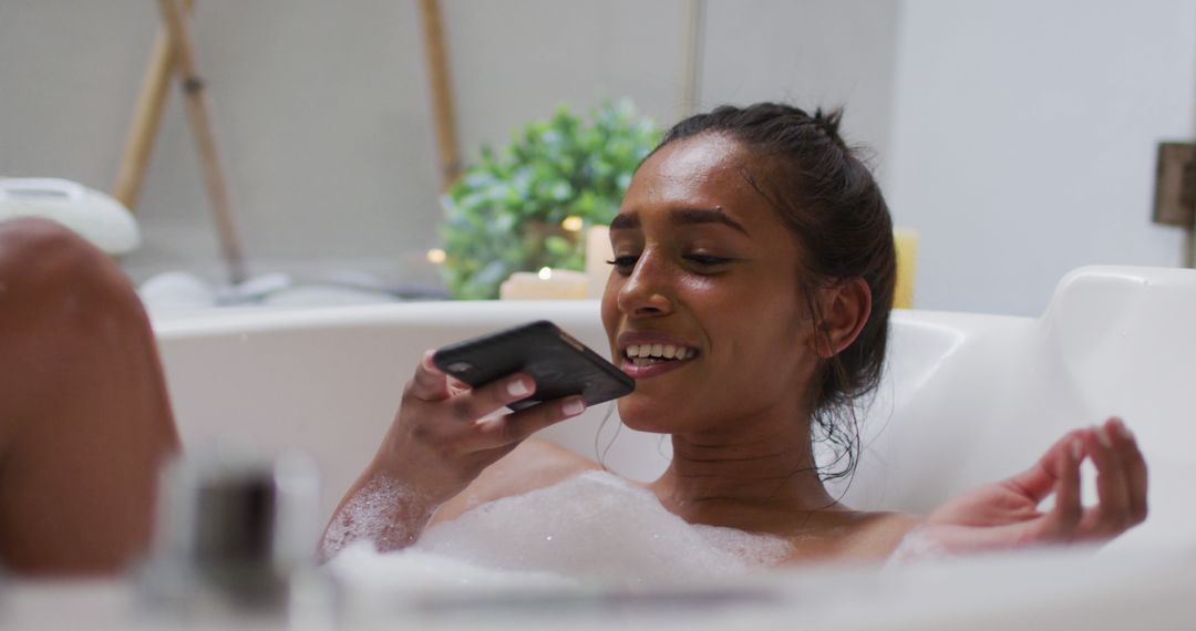 Woman Relaxing in Bathtub Talking on Smartphone at Home - Free Images, Stock Photos and Pictures on Pikwizard.com