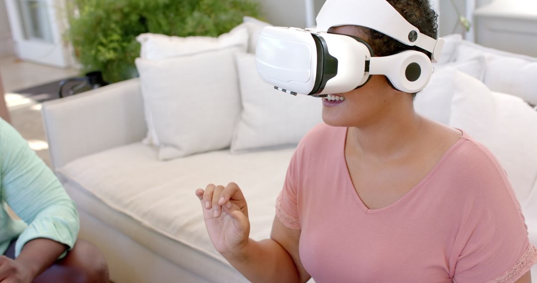 Woman Engaging with Virtual Reality on Couch