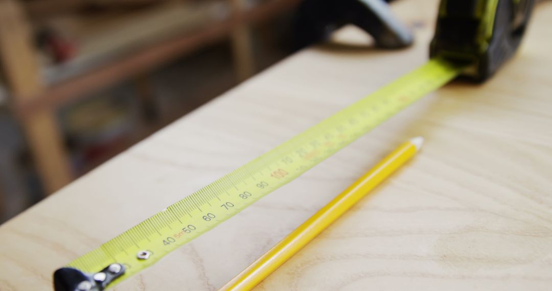 Carpenter Measuring Wooden Surface with Measuring Tape - Free Images, Stock Photos and Pictures on Pikwizard.com