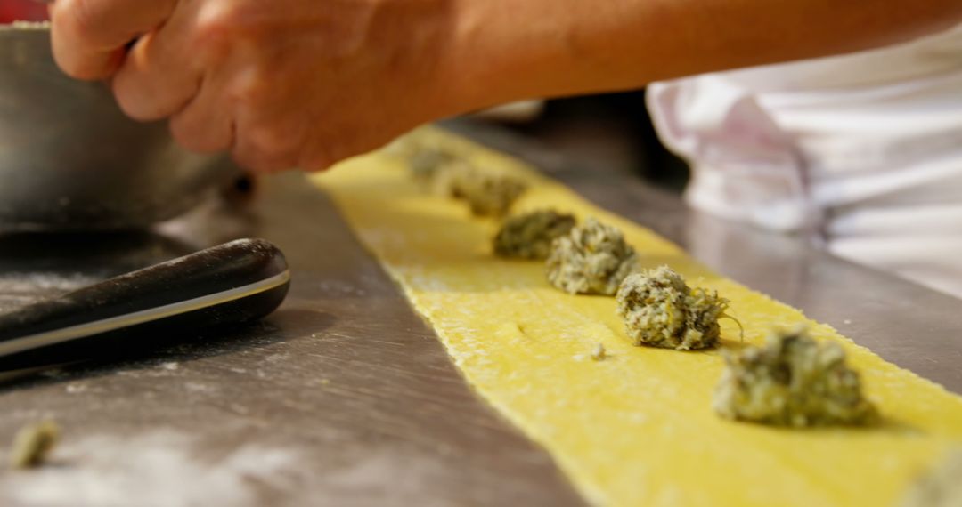 Person Preparing Fresh Homemade Ravioli with Spinach Ricotta Filling - Free Images, Stock Photos and Pictures on Pikwizard.com