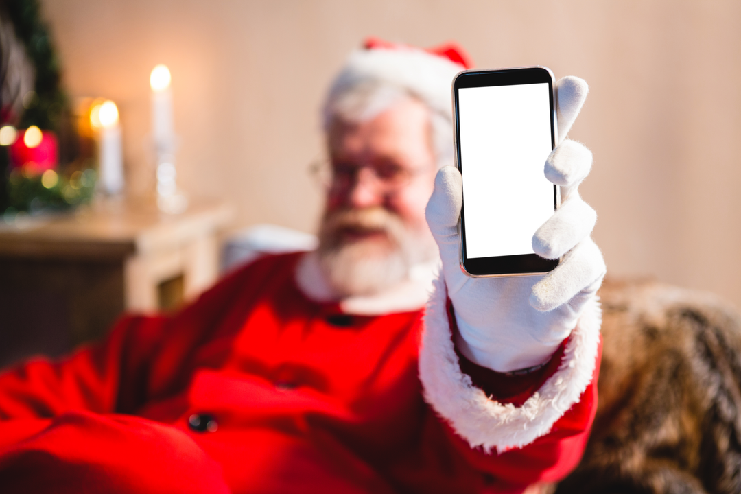 Close-up of Santa Claus Showing Smartphone with Transparent Screen - Download Free Stock Images Pikwizard.com