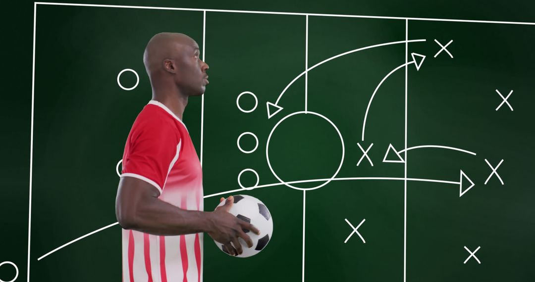Soccer Player Analyzing Game Strategy on Chalkboard
