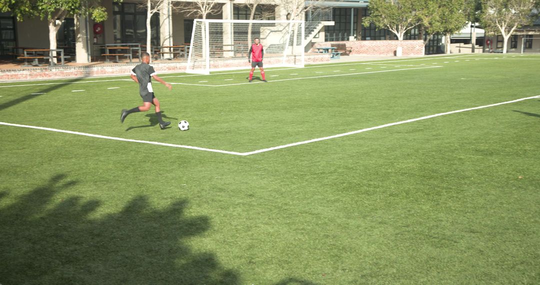 Soccer Players Practicing Teamwork and Strategy on Green Field