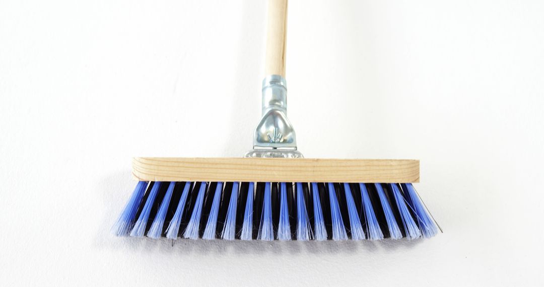 Wooden Handle Broom with Blue Bristles on White Background - Free Images, Stock Photos and Pictures on Pikwizard.com