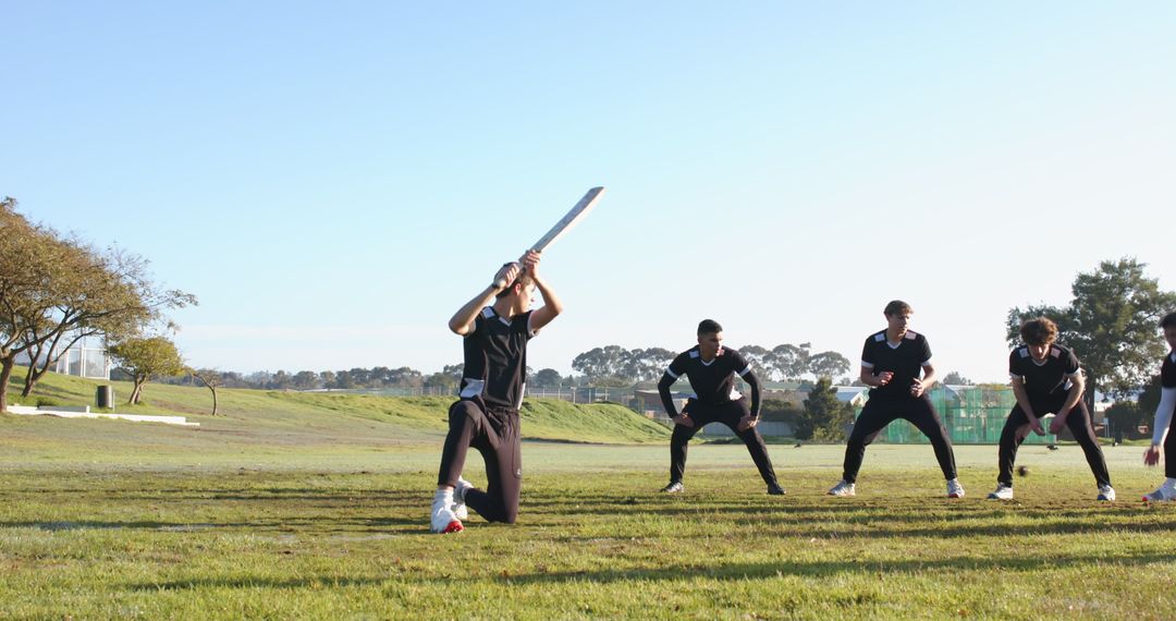 Cricketers Practicing Batting Techniques at Outdoor Field