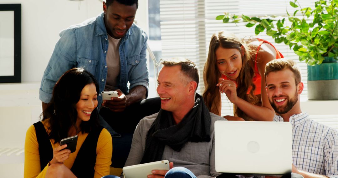 Diverse Group Collaborating with Digital Devices in Relaxed Setting