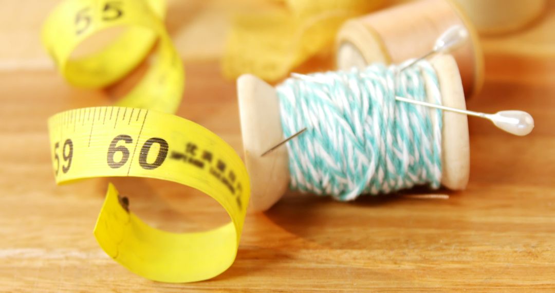 Yellow Measuring Tape and Spool of Twine on Wooden Surface - Free Images, Stock Photos and Pictures on Pikwizard.com