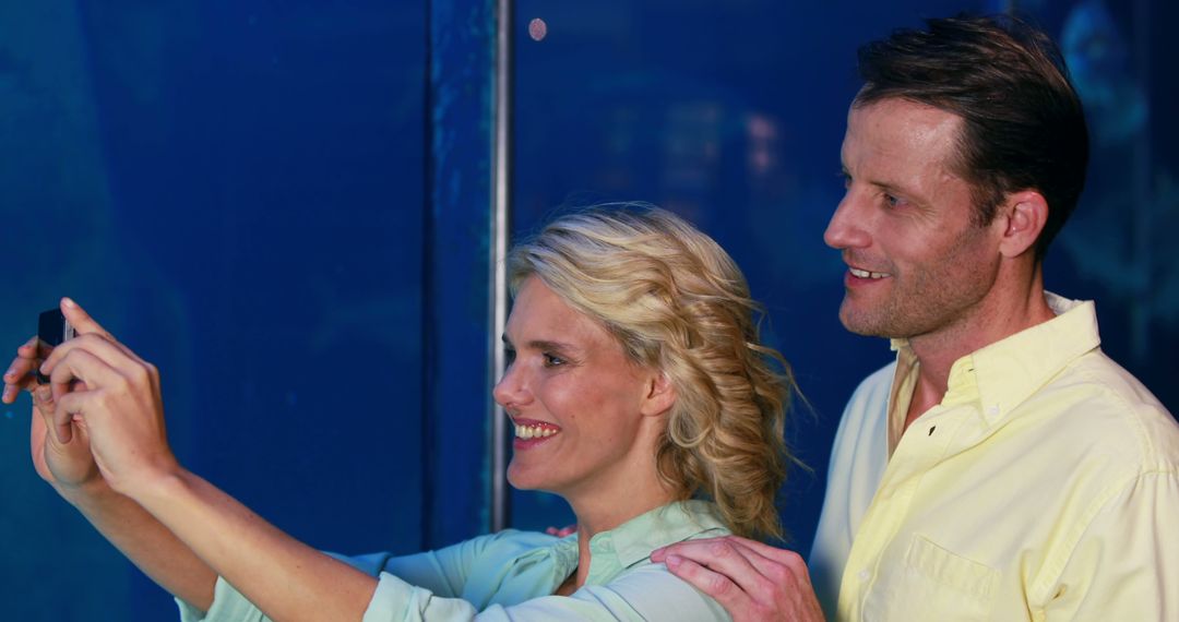 Middle-Aged Couple Enjoying Leisurely Date at Aquarium