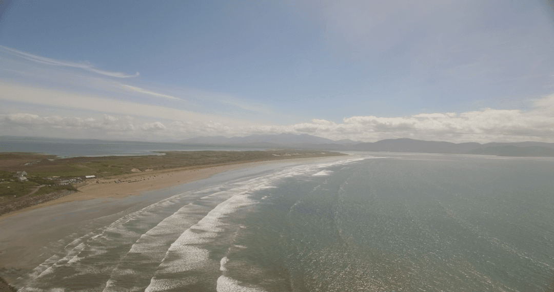 Transparent Ocean Waves Against Vast Coastal Horizon