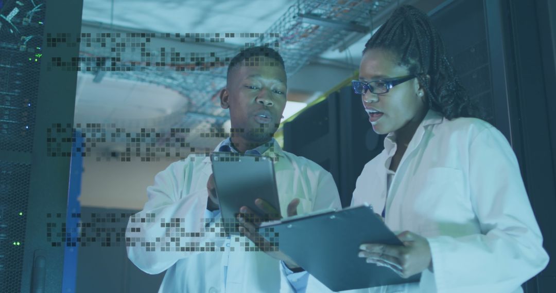 Focused Engineers Analyzing Data in Modern Server Room