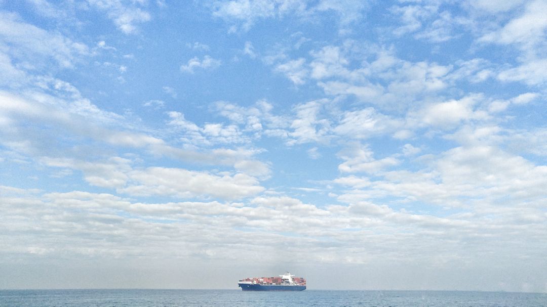Large Cargo Ship on Open Sea with Cloudy Sky - Free Images, Stock Photos and Pictures on Pikwizard.com