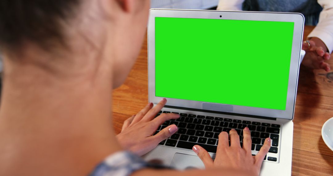 Person Using Laptop with Green Screen Workspace - Free Images, Stock Photos and Pictures on Pikwizard.com