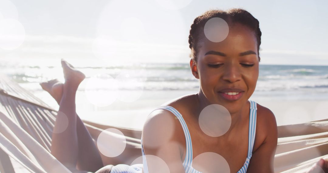 Relaxing in Beach Hammock Happy African Woman at Seaside