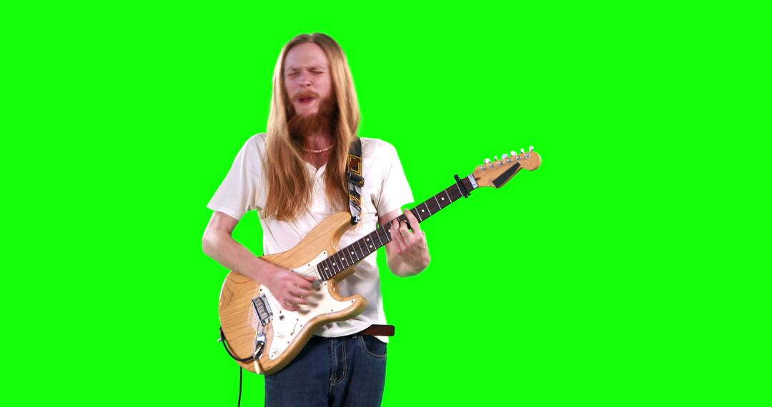 Man with Long Hair Playing Electric Guitar on Green Screen - Free Images, Stock Photos and Pictures on Pikwizard.com