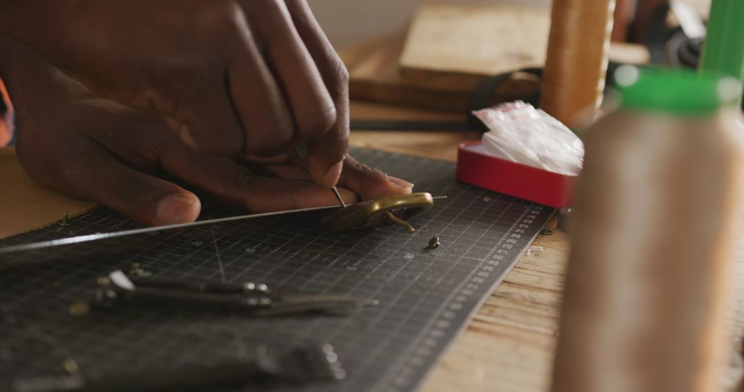 African American Craftsman Preparing Leather Belt in Workshop