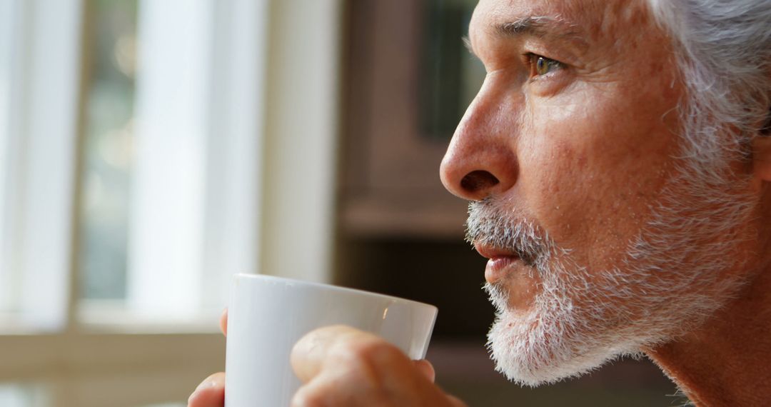 Senior Man Drinking Morning Coffee by Window - Free Images, Stock Photos and Pictures on Pikwizard.com