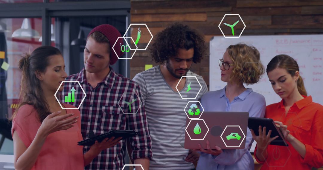 Diverse Team Analyzing Sustainable Business Data in Modern Office