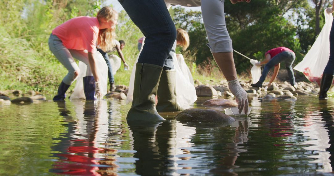 Volunteers Cleaning a River to Promote Environmental Awareness - Free Images, Stock Photos and Pictures on Pikwizard.com