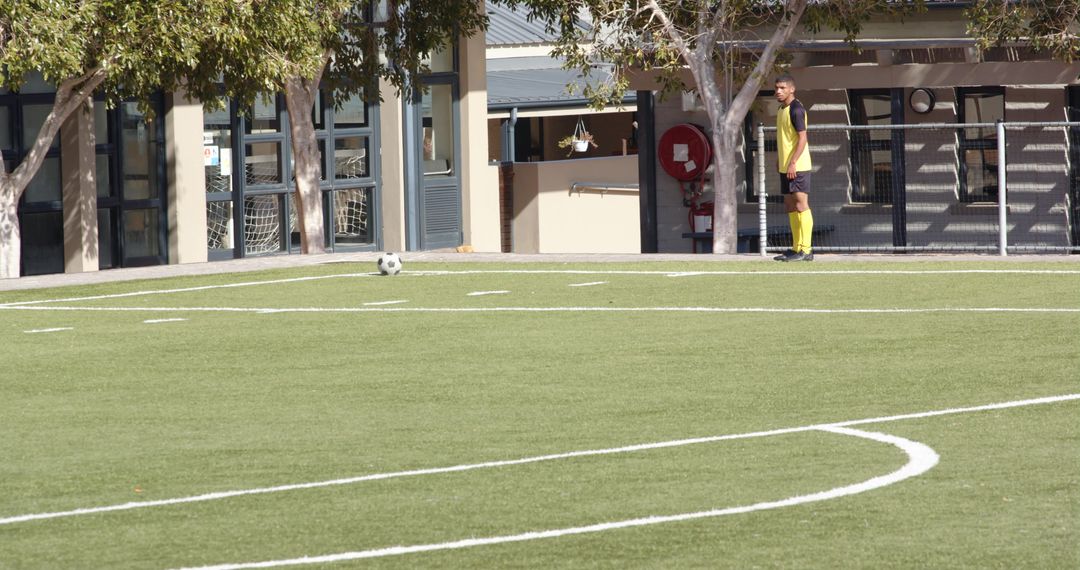 Soccer Player Focused on Gameplay on Field