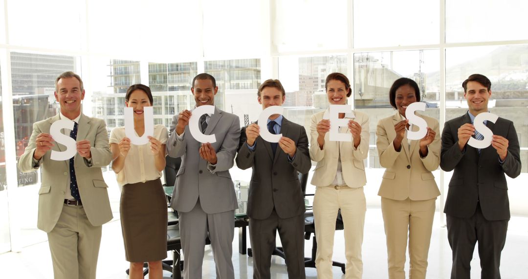 Diverse Business Team Holding Success Sign in Office - Free Images, Stock Photos and Pictures on Pikwizard.com