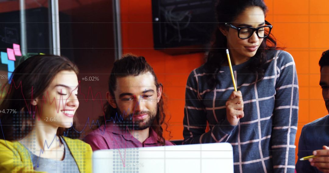 Colleagues Collaborating with Financial Projection Overlays in Office