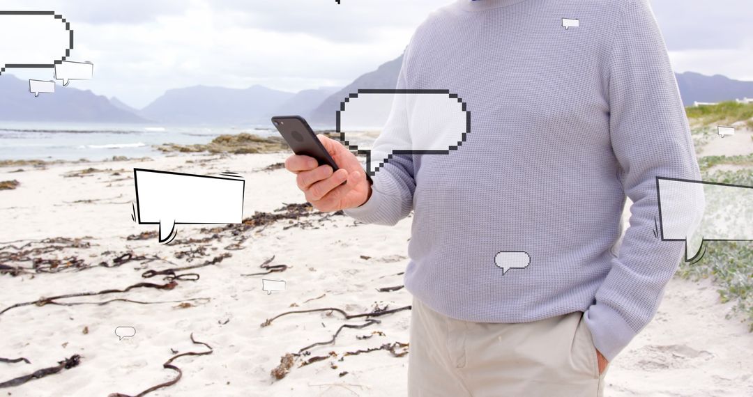 Man Browsing Smartphone with Speech Bubbles on Scenic Beach
