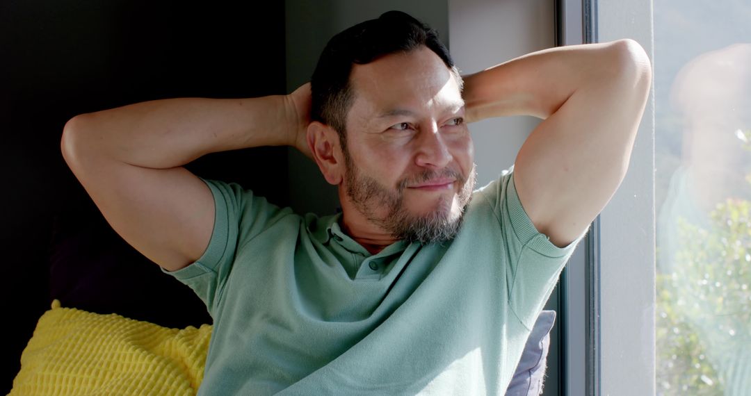 Man Relaxing at Home Near Window Embracing Tranquility