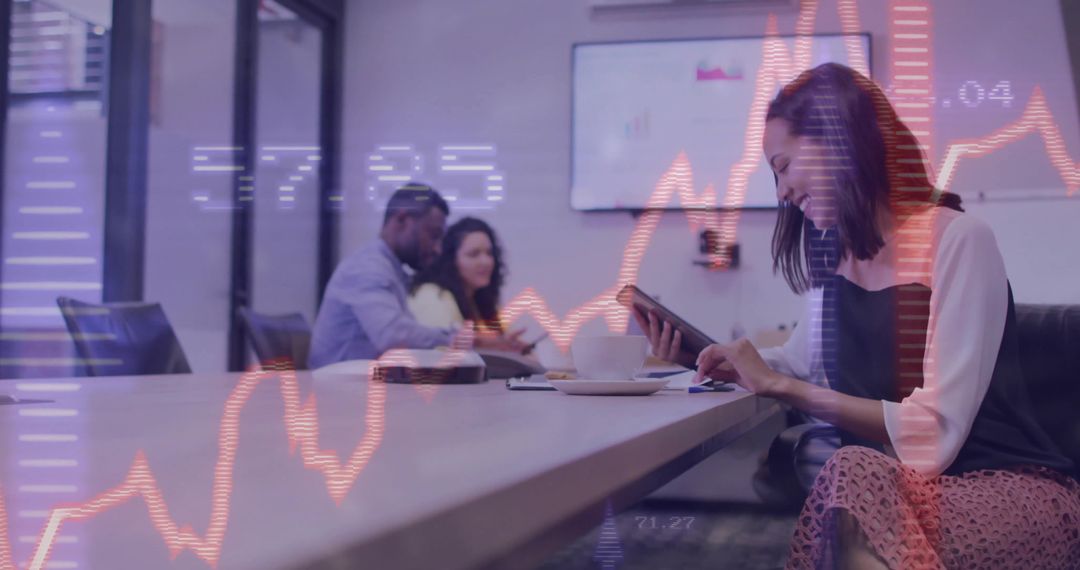 Asian Executive Analyzing Data on Tablet in Modern Meeting Room