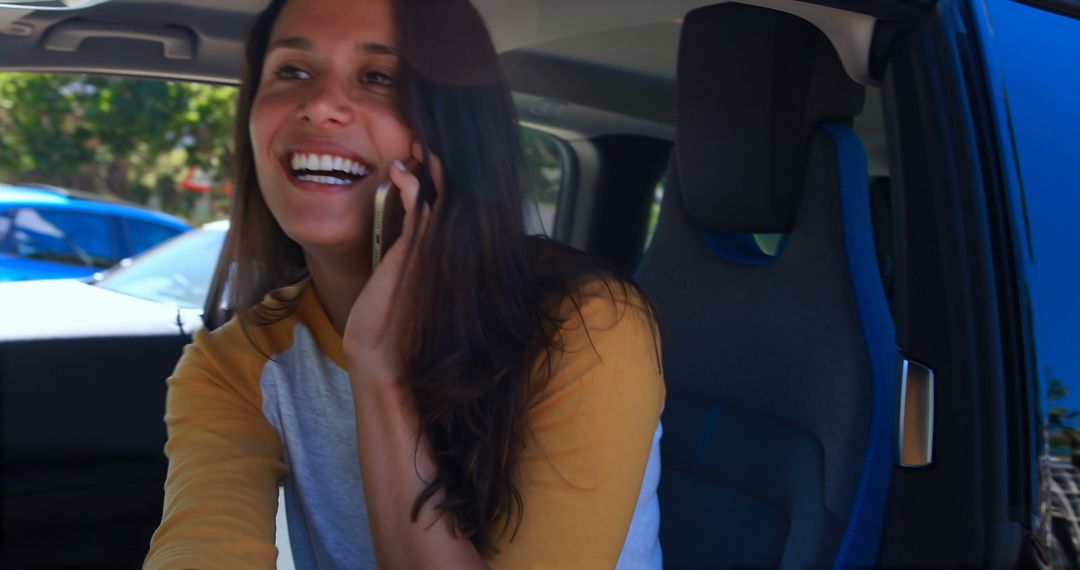 Woman In Car Talking On Phone Smiling Having A Happy Conversation - Free Images, Stock Photos and Pictures on Pikwizard.com