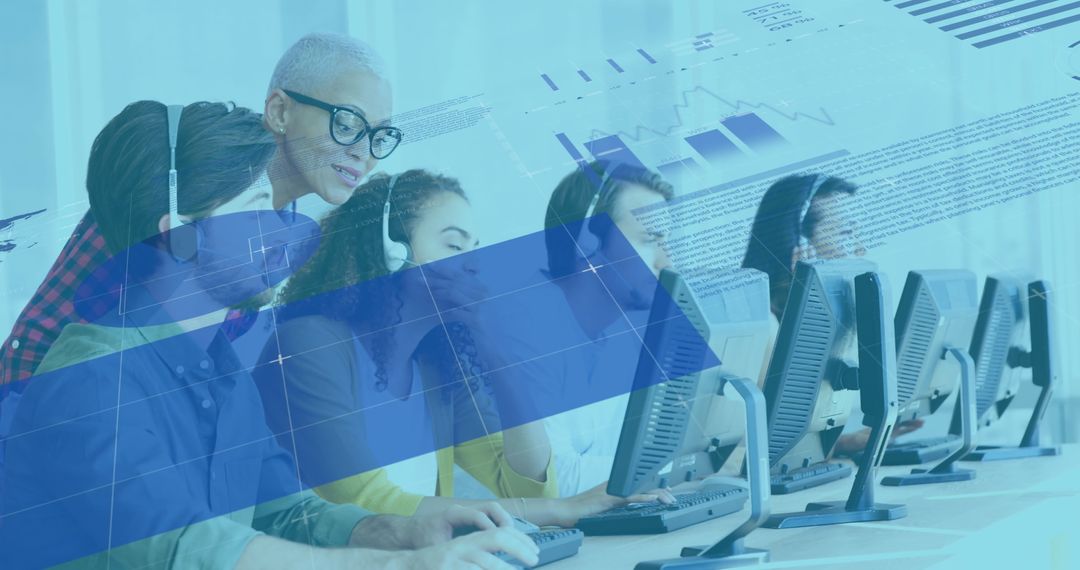 Diverse Team Analyzing Digital Data on Computers in Modern Office