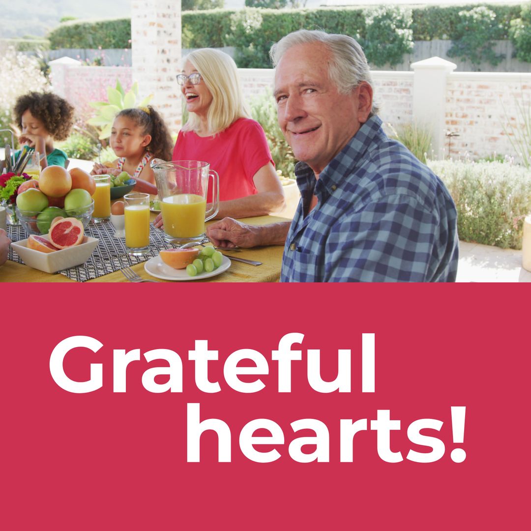 Multigenerational Family Enjoying Thanksgiving Meal Outdoors