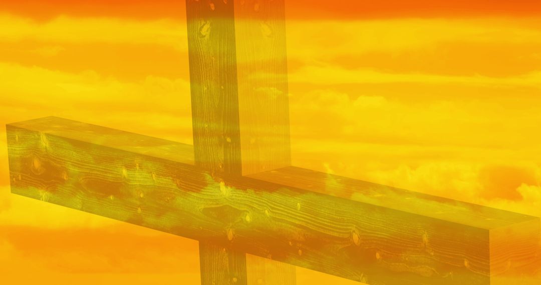 Silhouette of Christian Cross Against Yellow Sky